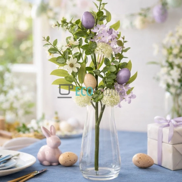 Декоративна великодня гілка з яйцями, квітами та листям  ...